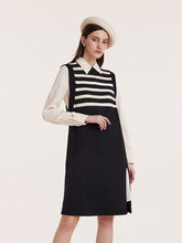 A lady with a beret wears a striped shift dress.